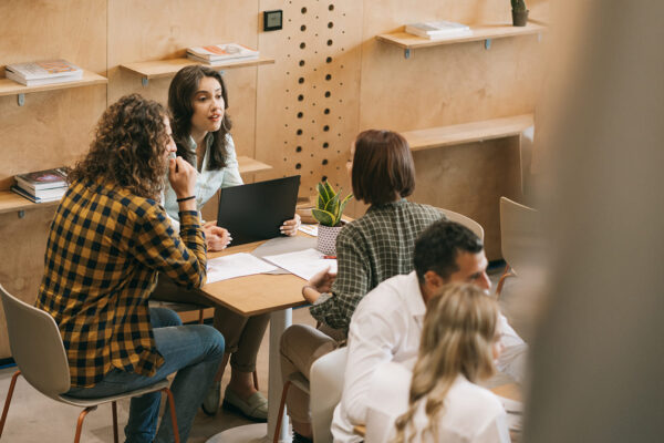 Technology Solutions - Employees discussing market strategy