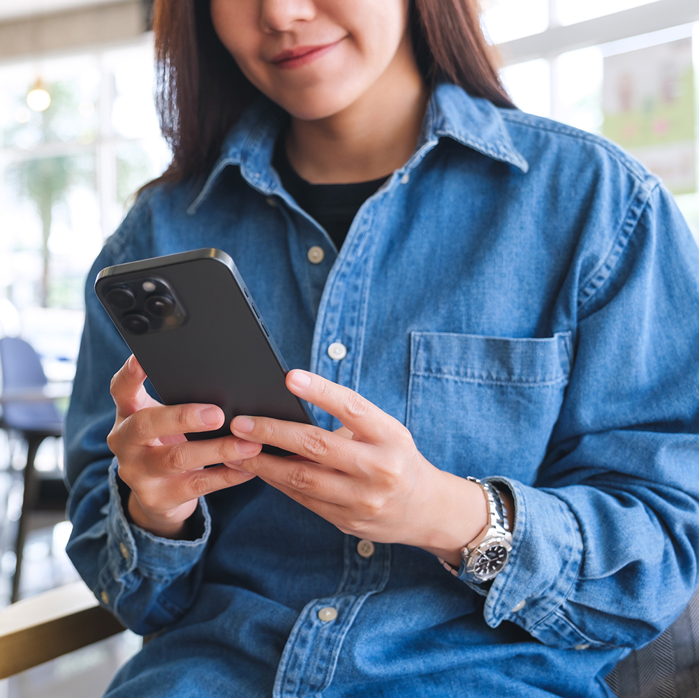 Digital Marketing - Woman using a smartphone to watch content